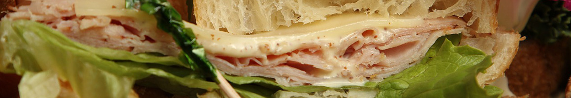 Eating Sandwich Cheesesteak at Lee's Hoagie House restaurant in Bensalem, PA.